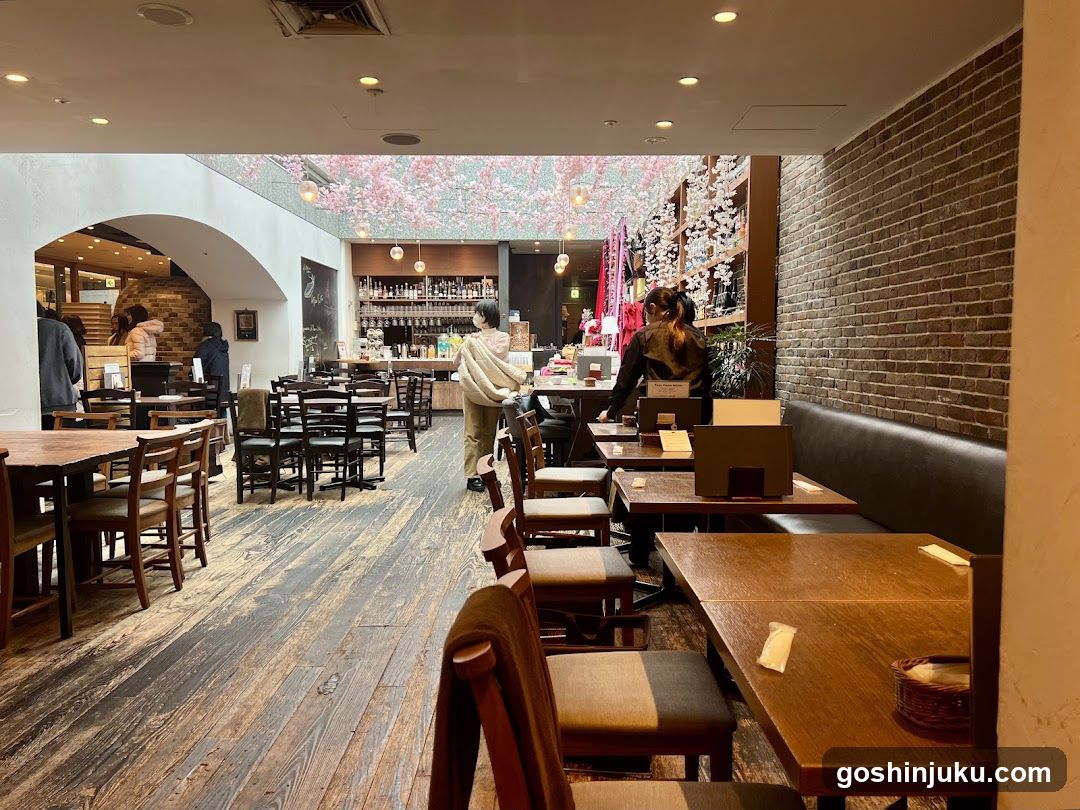 Interior of a cozy restaurant or cafe with wooden tables and cherry blossom decorations