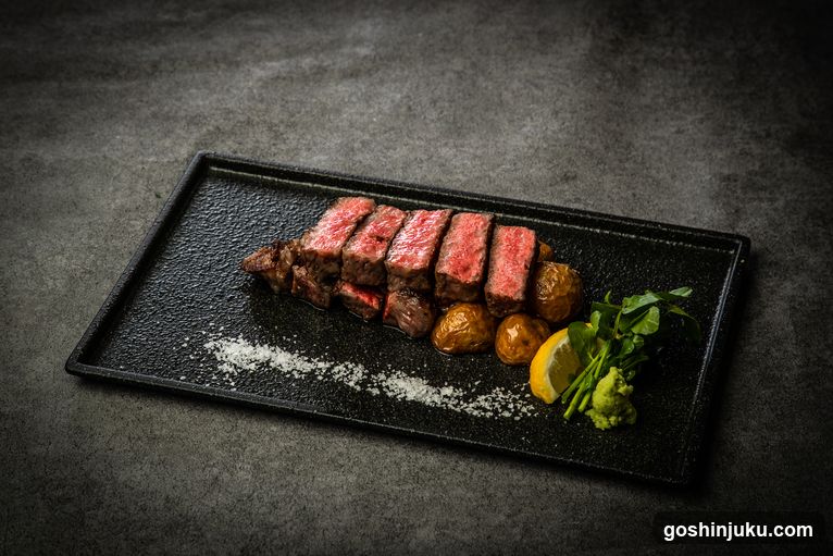 Sliced Steak with Potatoes and Garnish