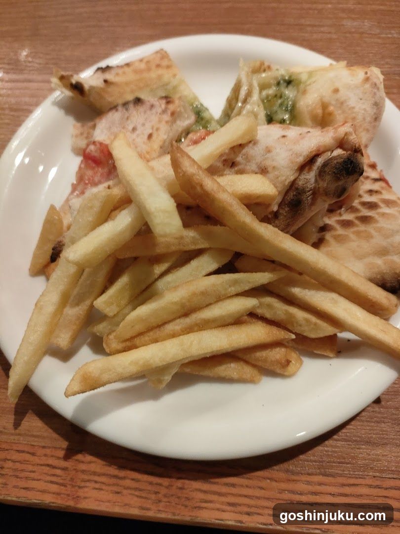 Plate of French Fries and Pizza Slices