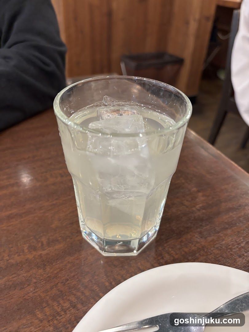 Glass of Iced Drink on Wooden Table