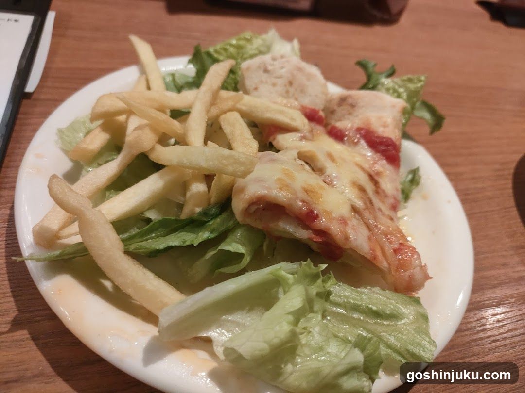 Plate of food with fries and lettuce