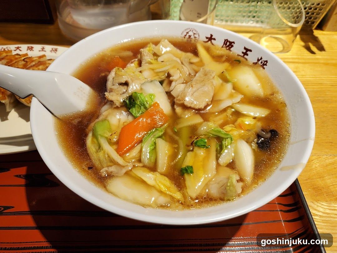 Bowl of Soup with Vegetables and Meat