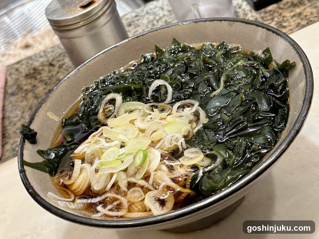 Bowl of seaweed soup with scallions