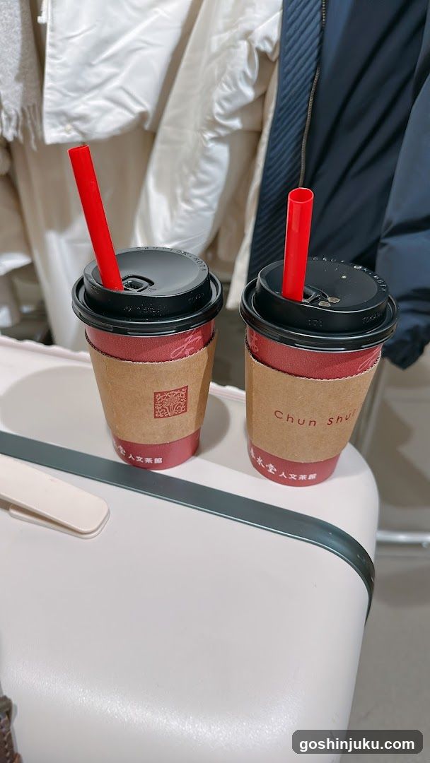 Two beverages in branded cups