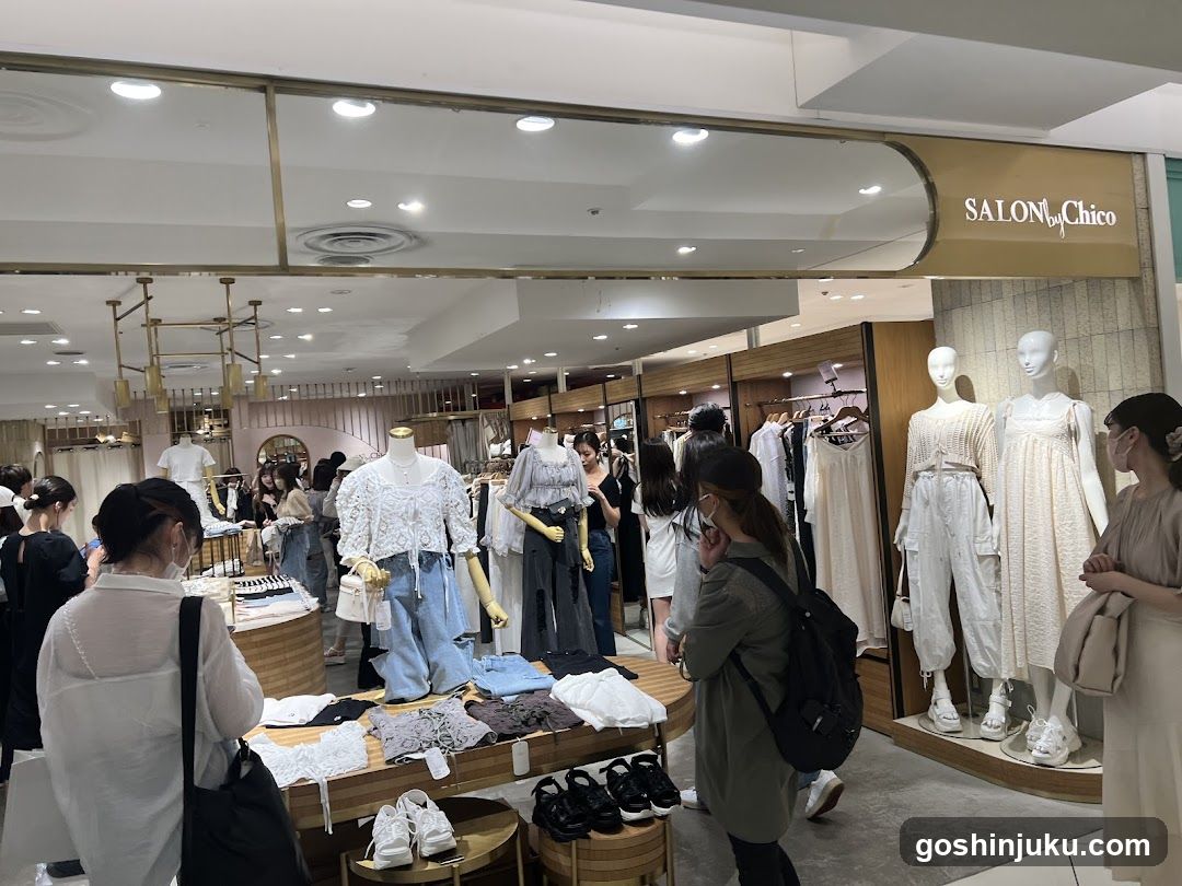 Fashion Store Interior with Mannequins and Shoppers
