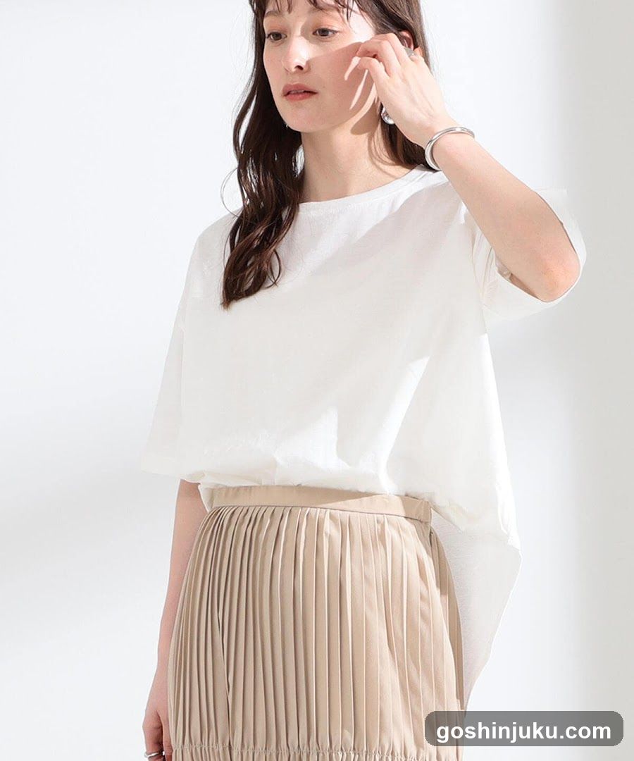 Fashion Model Wearing White Top and Pleated Skirt