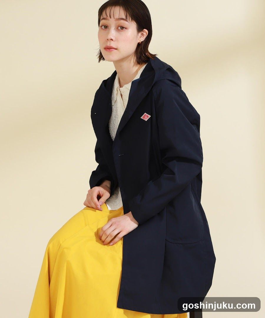 Fashion Model in Navy Raincoat and Yellow Skirt