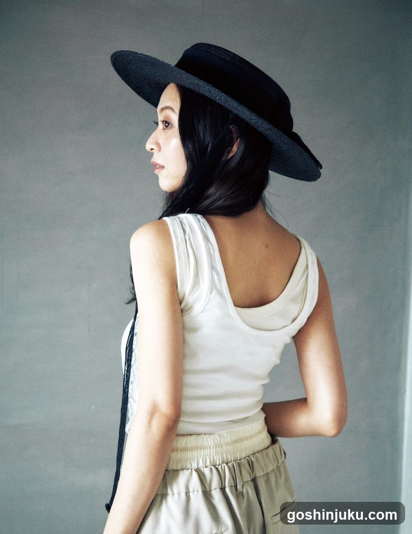 Woman in Hat and White Top