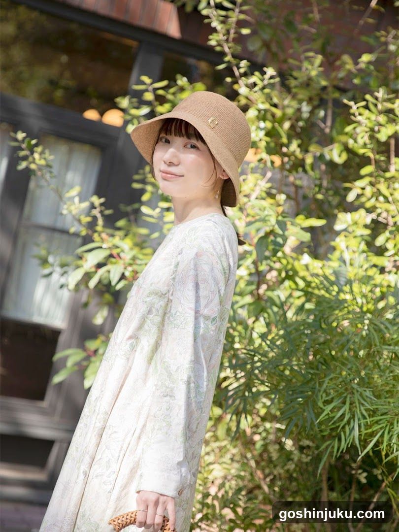 Woman in Hat and Floral Dress