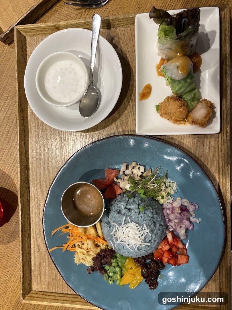 Food Tray with Blue Rice Bowl and Spring Rolls