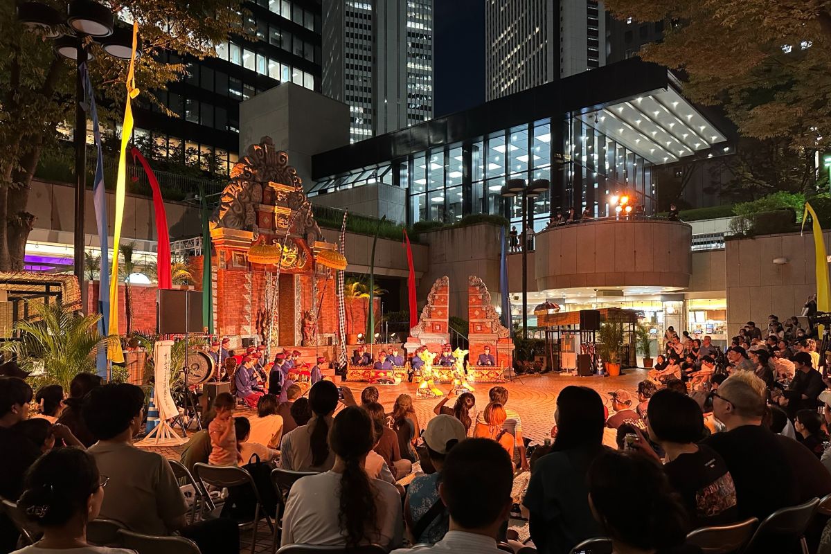 Balinese Kecak dancers in traditional masks and costumes at the Shinjuku Mitsui Building