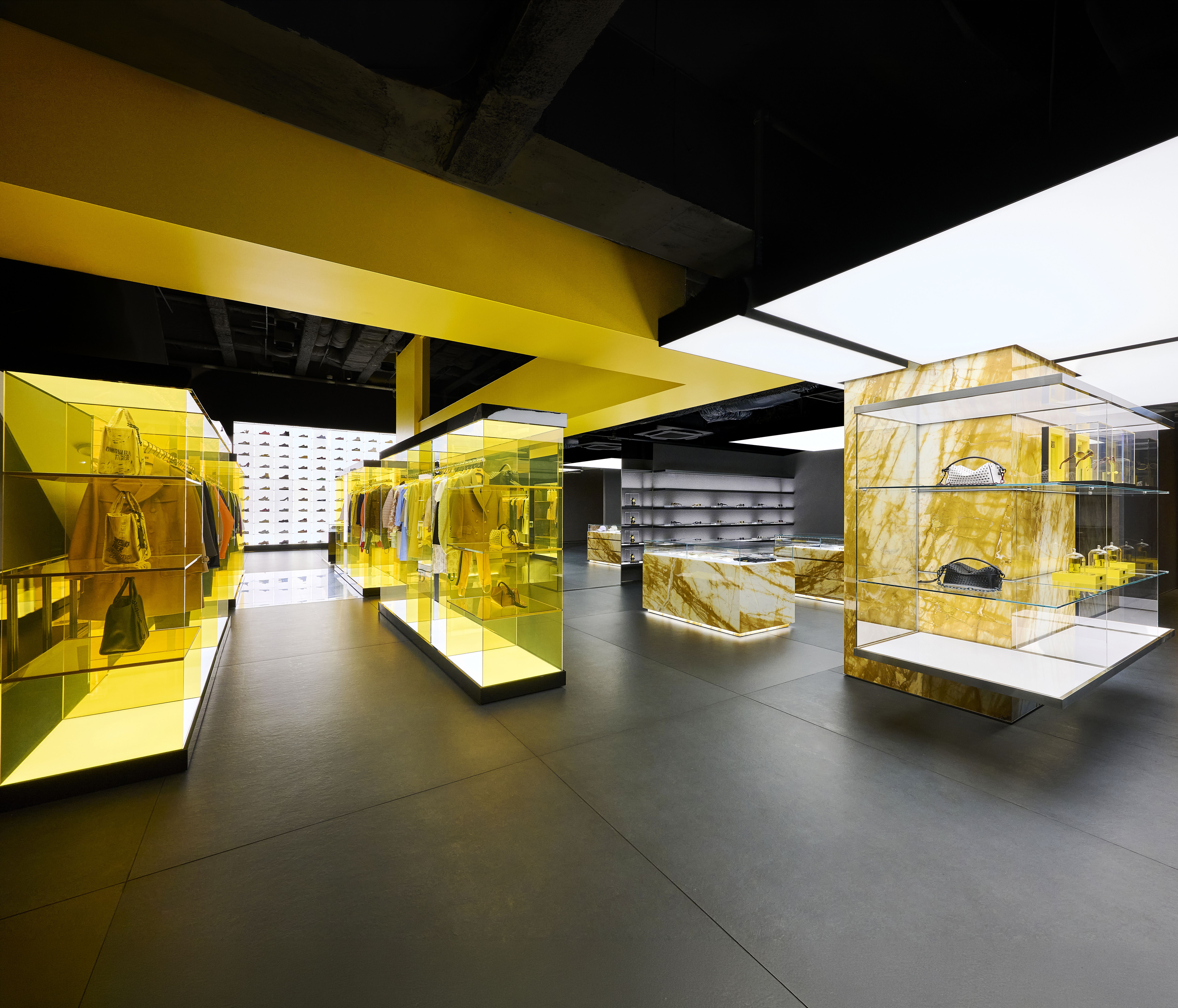Onitsuka Tiger Shinjuku first floor with black flooring and Giallo Siena marble