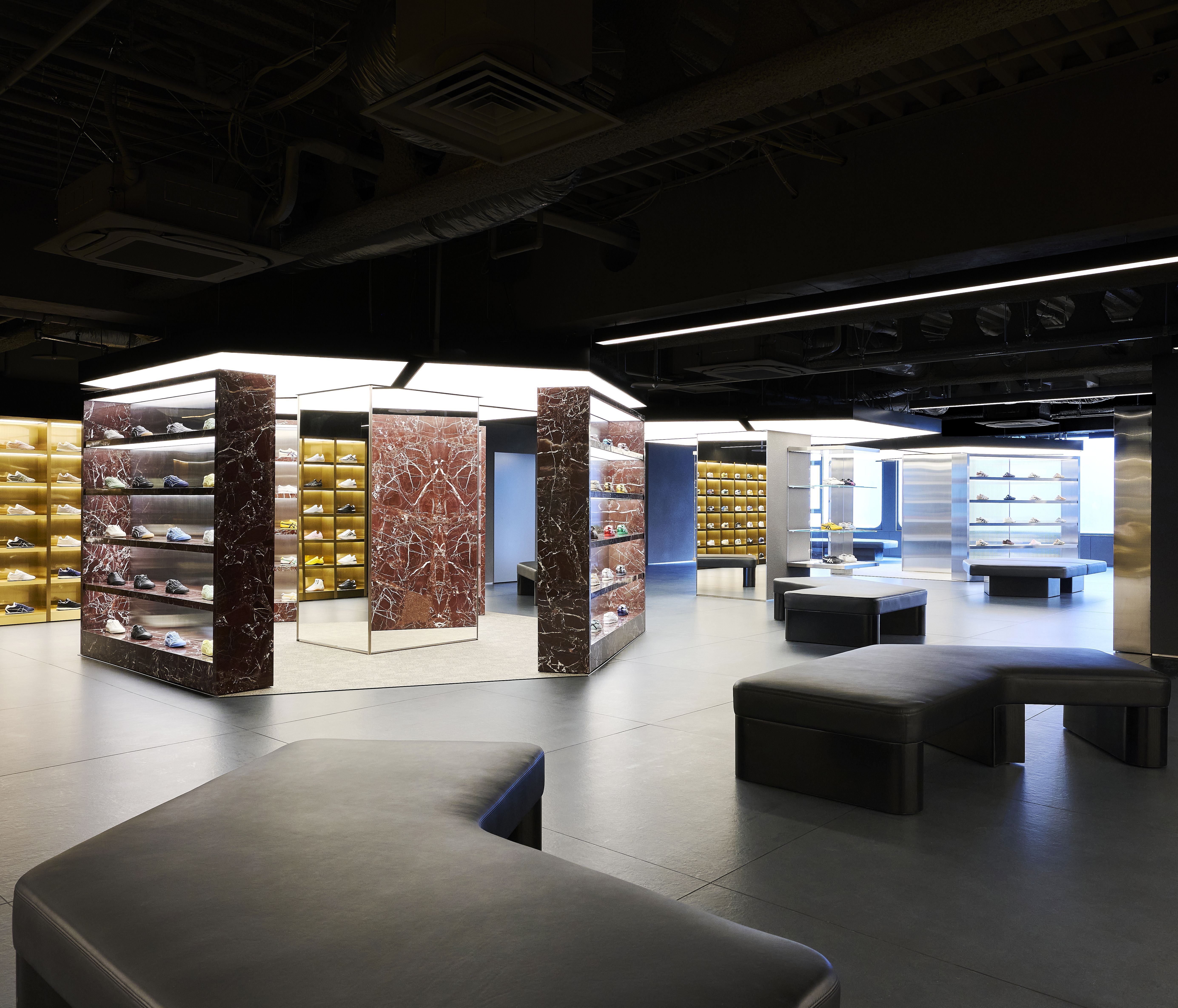 Third floor of Onitsuka Tiger Shinjuku with Rosso Lepanto marble and gallery-like displays