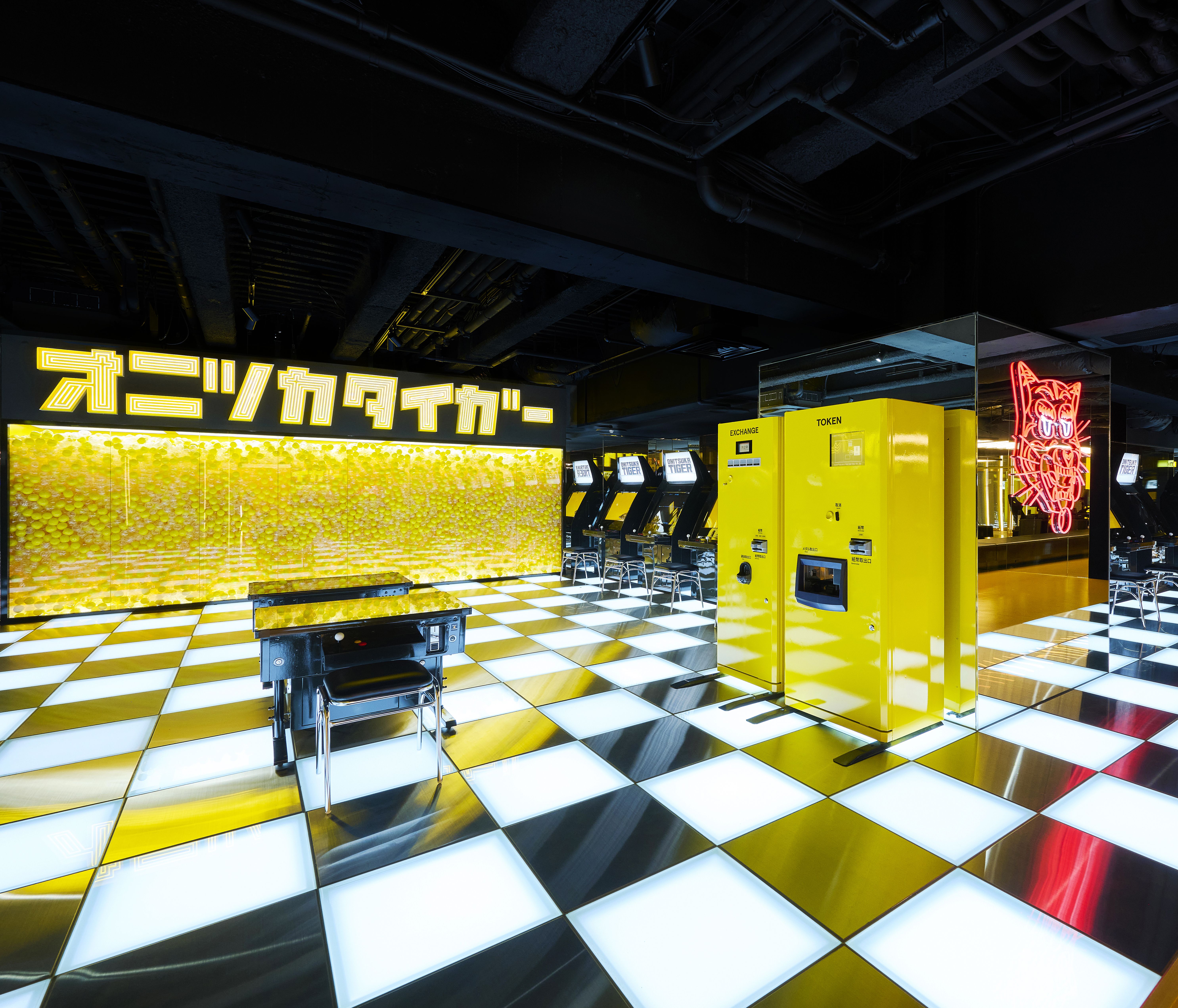 Mezzanine amusement area at Onitsuka Tiger Shinjuku flagship with GENDA GiGO